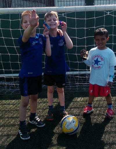 Kids and Football Trophies