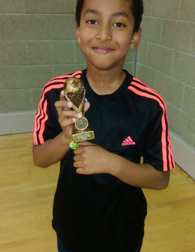 Kids and Football Trophies