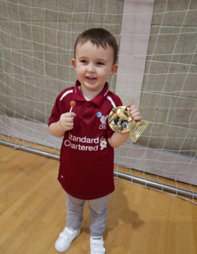 Kids and Football Trophies