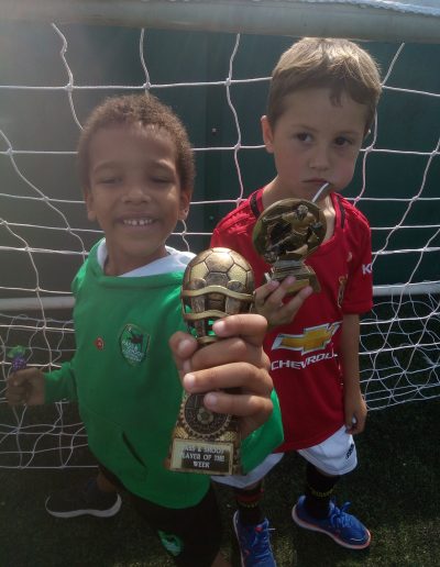 Kids and Football Trophies