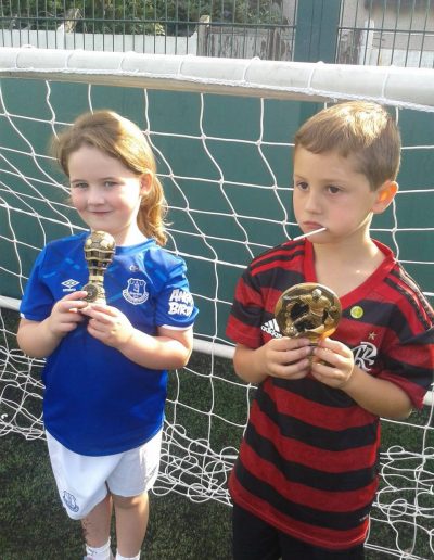 Kids and Football Trophies