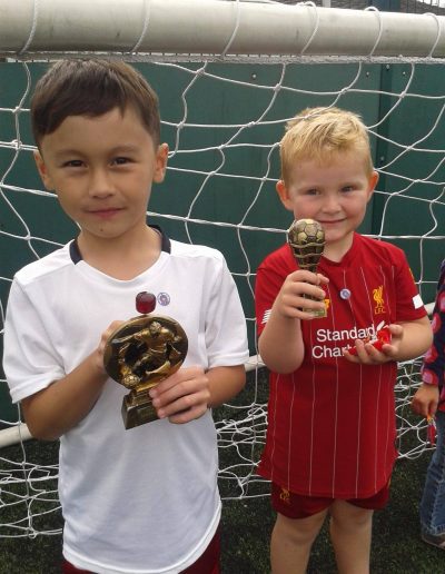 Kids and Football Trophies
