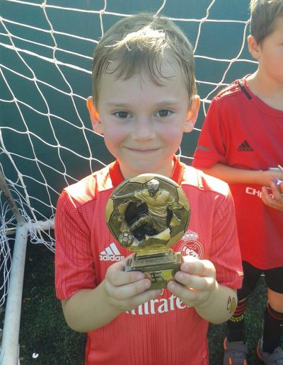 Kids and Football Trophies