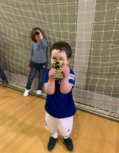 Kids and Football Trophies