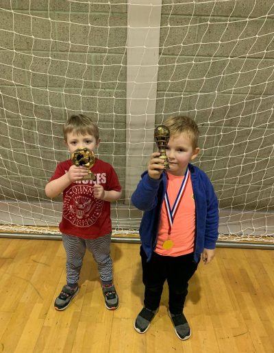 Kids and Football Trophies